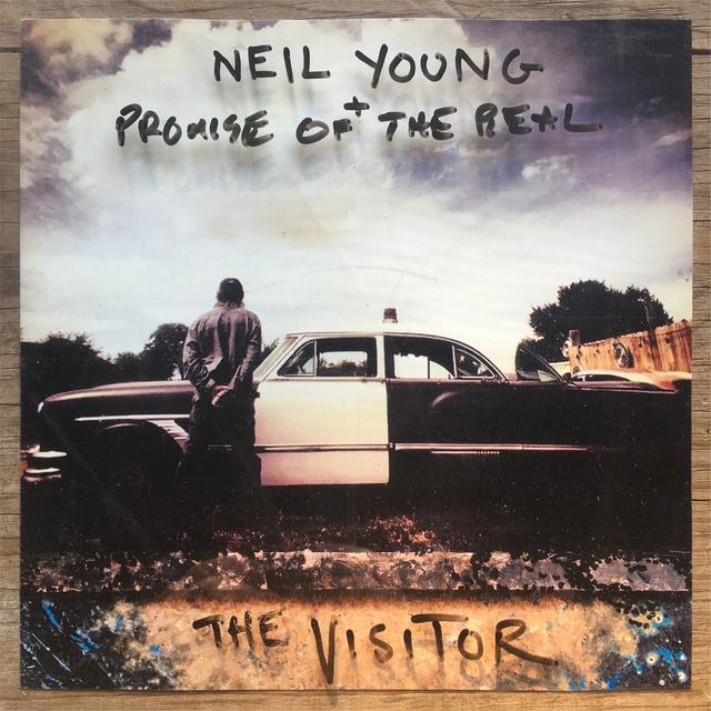 Album cover art for The Visitor